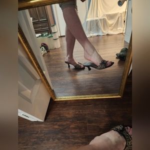 Well worn PENMANS cheetah slip on mules size 7 kitten heel